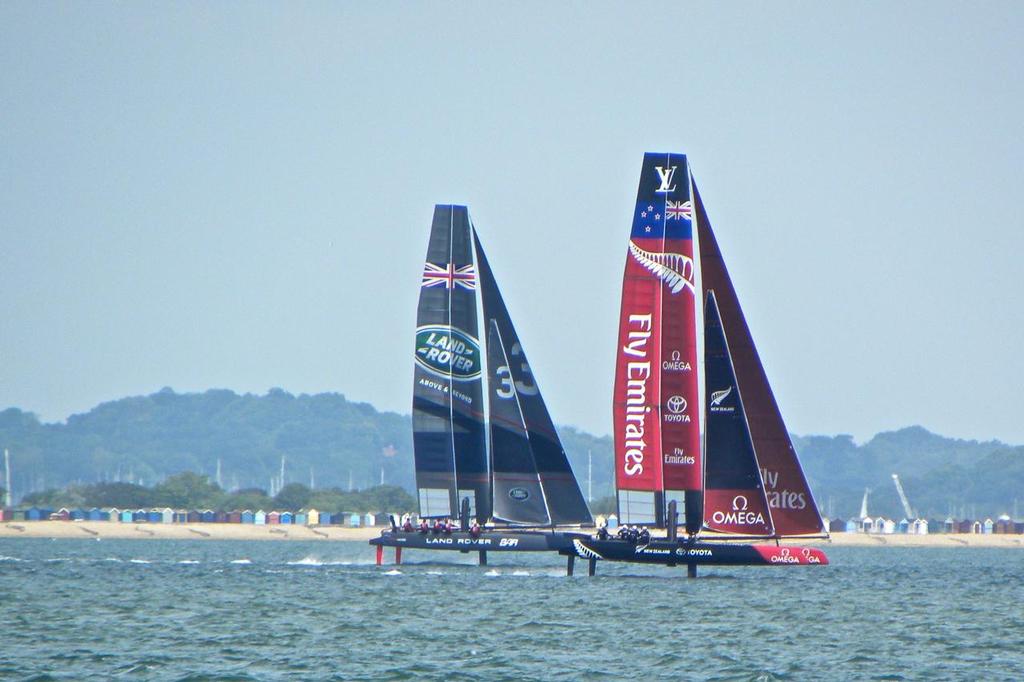 Emirates Team New Zealand and Ben Ainslie Racing line up off Cowes, Isle of Wight, June 29, 2015  © Pete Newlands